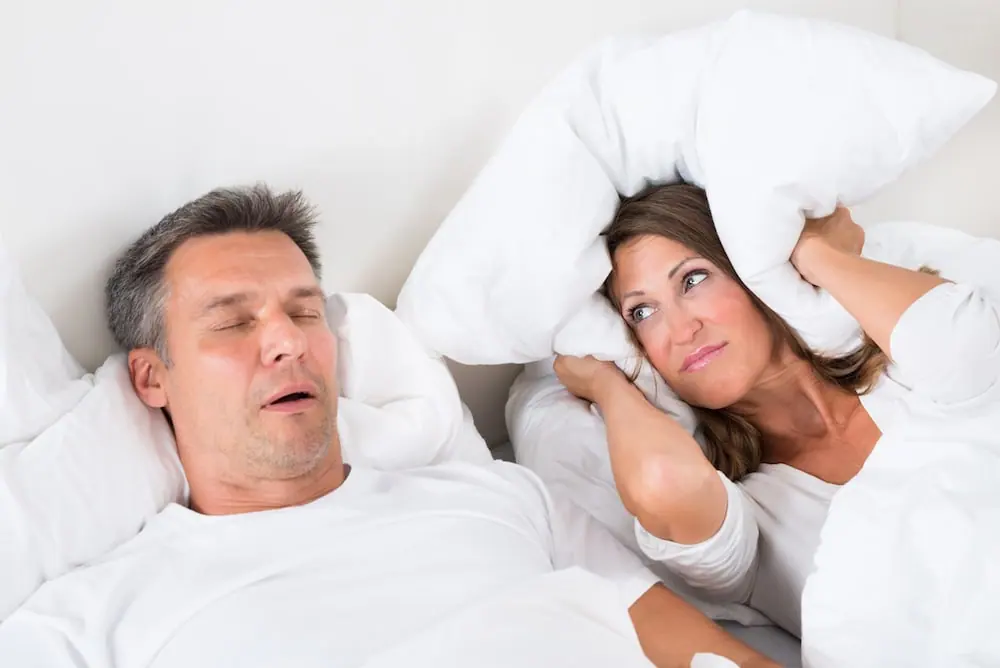 Angry Woman Trying To Sleep With Snoring Man